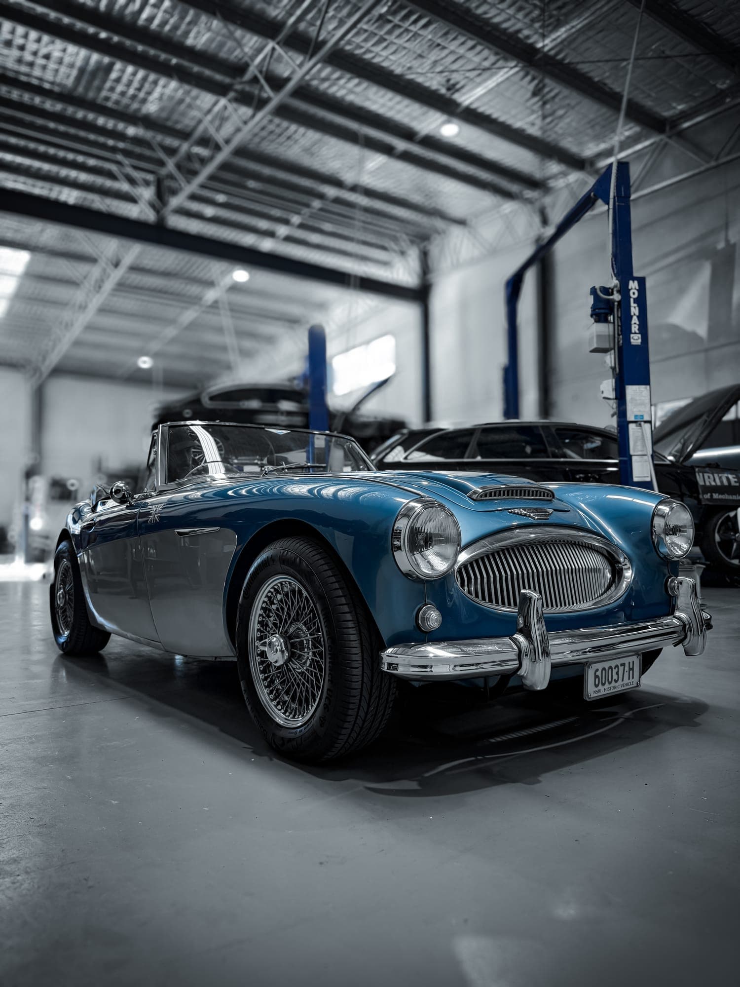 Blue Austin Healey 3000 on wire wheels in for classic car service