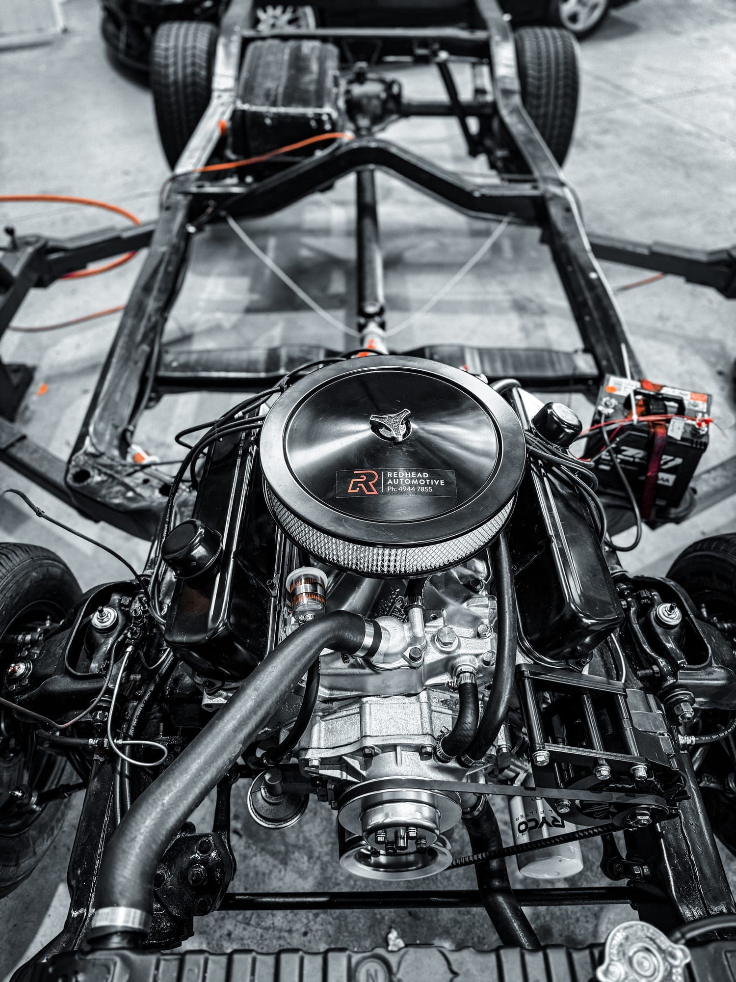 Classic car rolling chassis with freshly rebuilt V8 engine