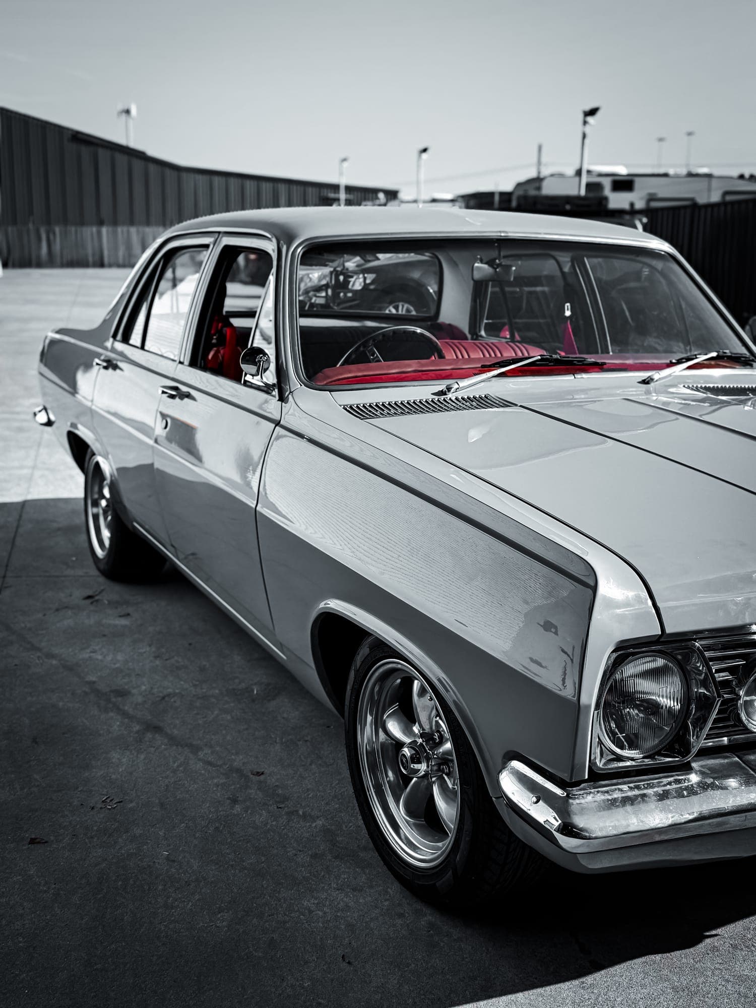 Classic HR Holden sedan with red interior after restoration work