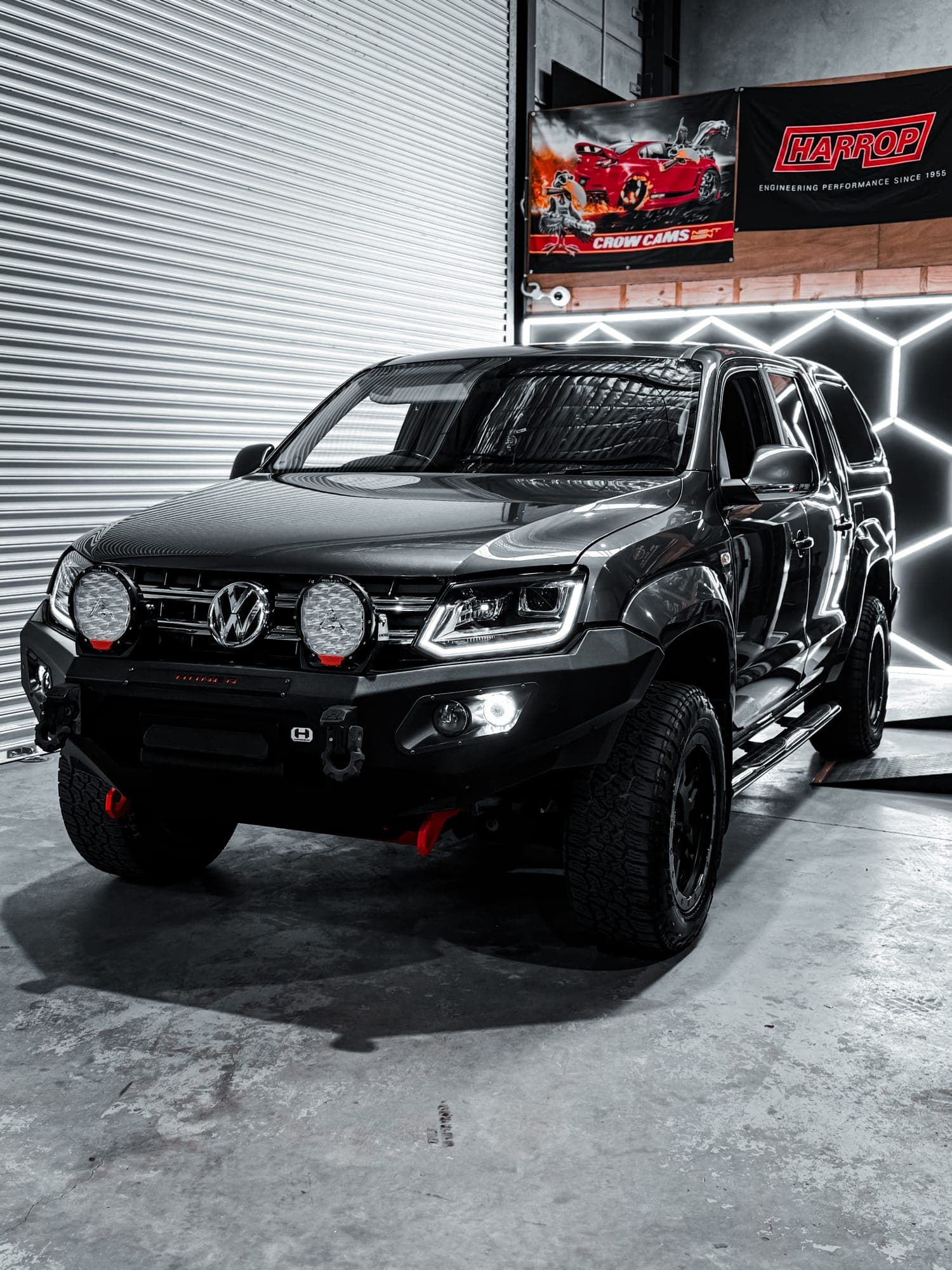 Black VW Amarok custom build with canopy, bar work and driving lights