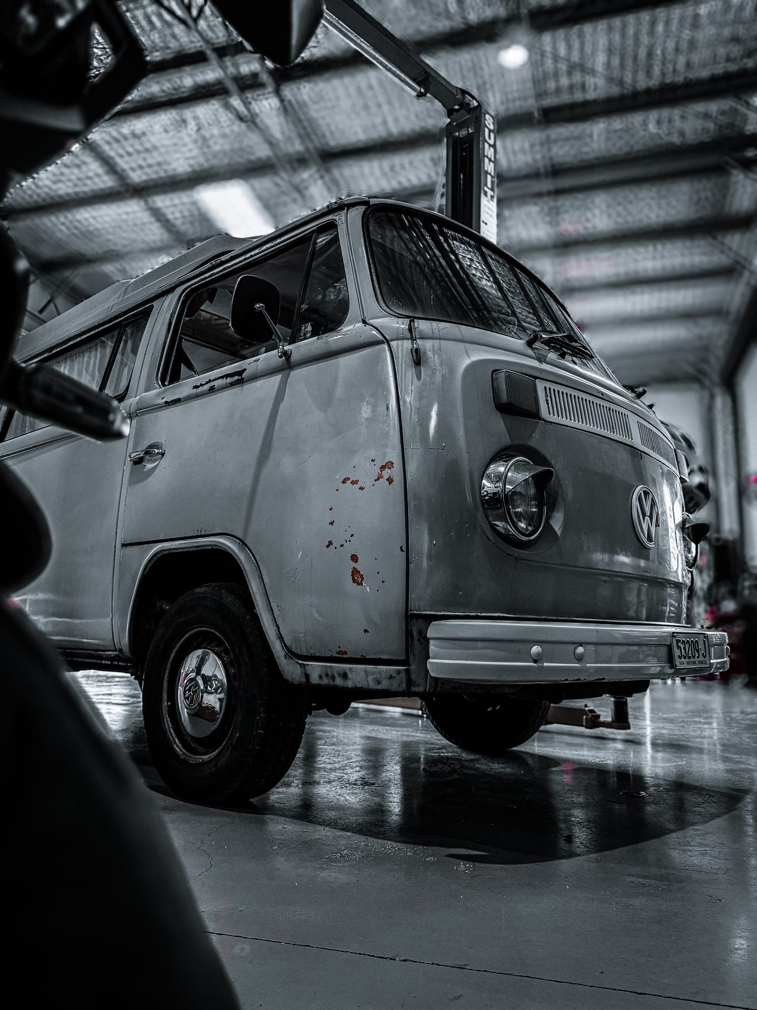 Volkswagen Kombi T2 bus on historic plates in the Redhead workshop