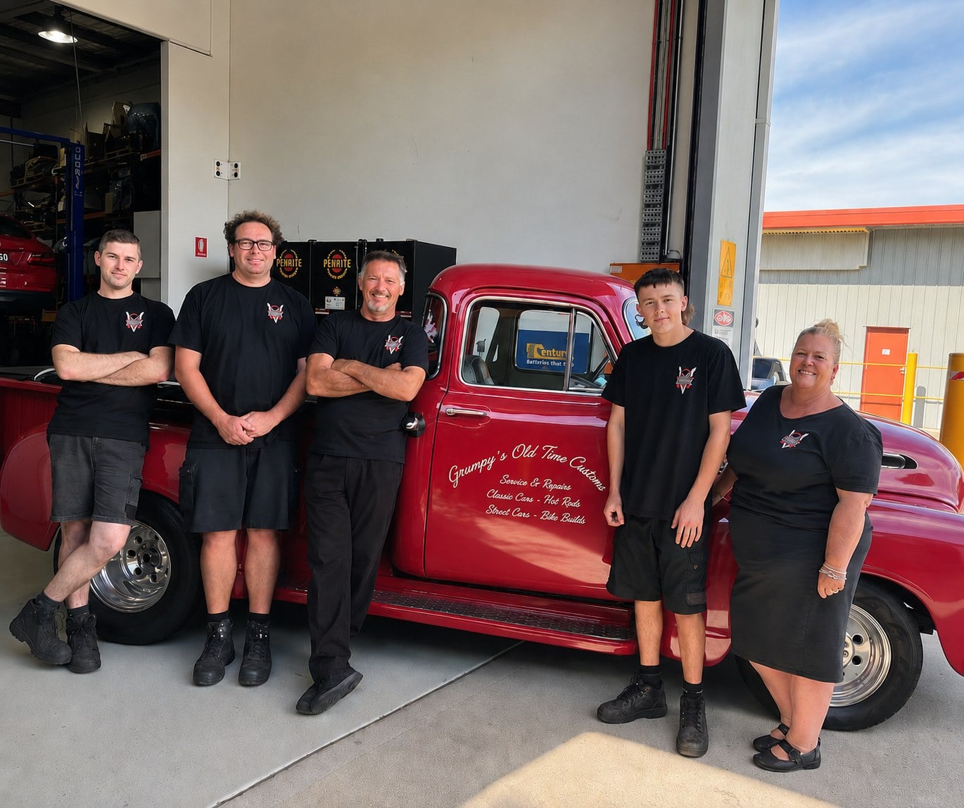 The Redhead Automotive team in front of Crumpy's Old Time Customs truck at the Redhead NSW workshop